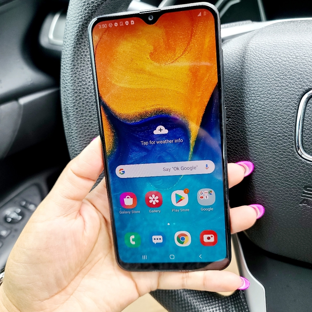 Samsung Galaxy A20, including charger